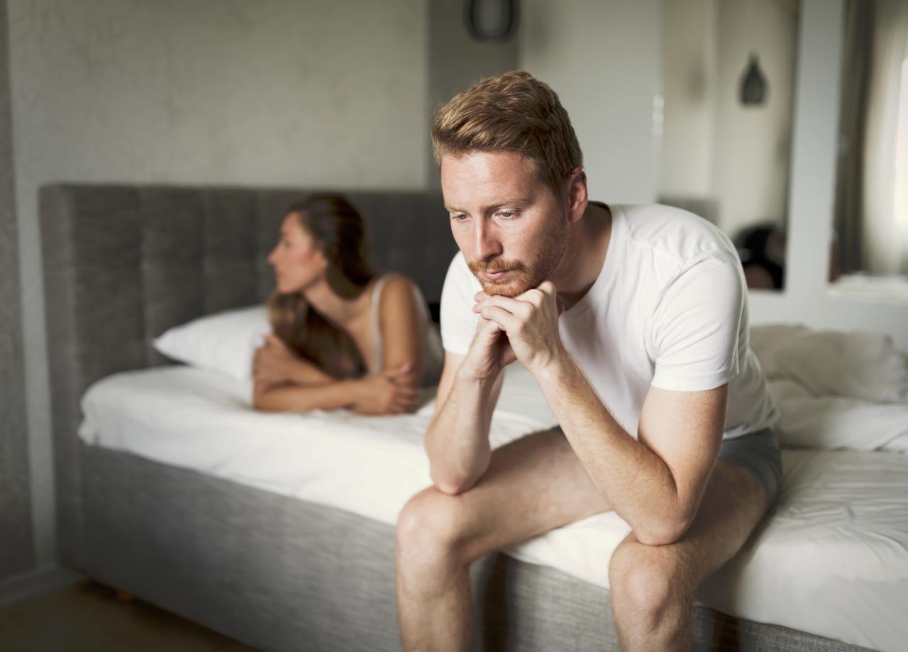 Couple in bed with problems